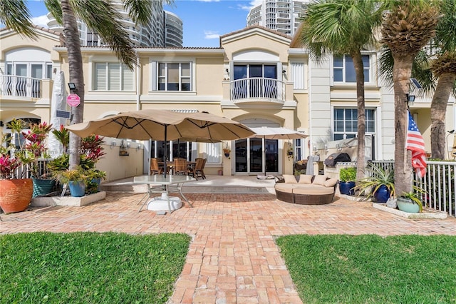 21109 NE 38th Ave Unit 74, Aventura, FL 33180 - rear view of property featuring a patio area and stucco siding