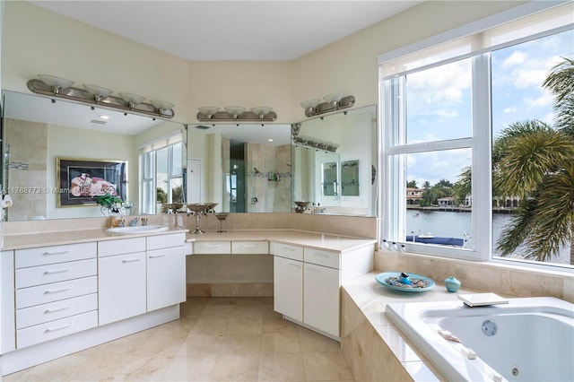 21109 NE 38th Ave Unit 74, Aventura, FL 33180 - bathroom featuring tile patterned floors, plenty of natural light, a stall shower, and a jetted tub
