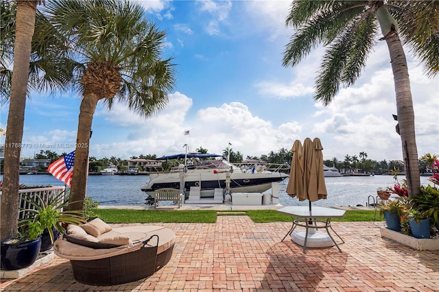 21109 NE 38th Ave Unit 74, Aventura, FL 33180 - view of patio with boat lift, a boat dock, and a water view