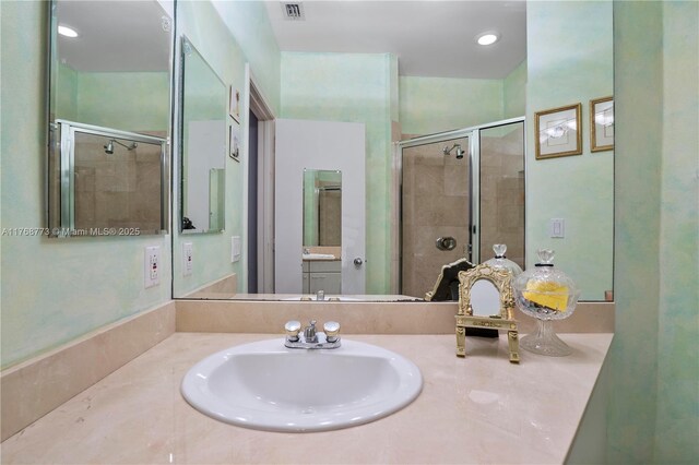 21109 NE 38th Ave Unit 74, Aventura, FL 33180 - bathroom with visible vents, a stall shower, and vanity