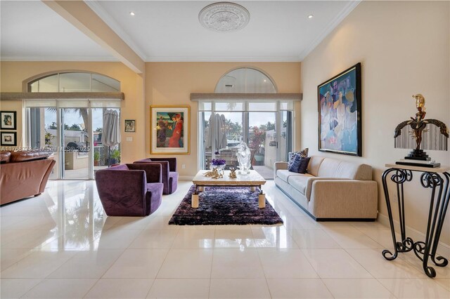 21109 NE 38th Ave Unit 74, Aventura, FL 33180 - living room featuring tile patterned flooring, crown molding, and baseboards