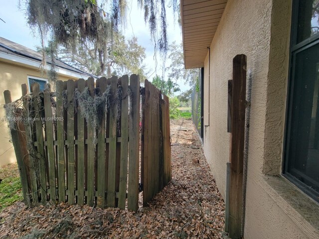 4904 Yellowstone Dr, New Port Richey, FL 34655 - view of property exterior with fence and stucco siding