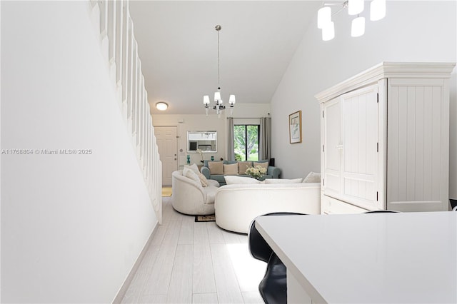4016 Palm Bay Cir Unit C, West Palm Beach, FL 33406 - living room featuring a chandelier, high vaulted ceiling, and stairs