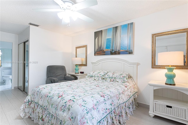 4016 Palm Bay Cir Unit C, West Palm Beach, FL 33406 - bedroom with a textured ceiling, ceiling fan, and baseboards