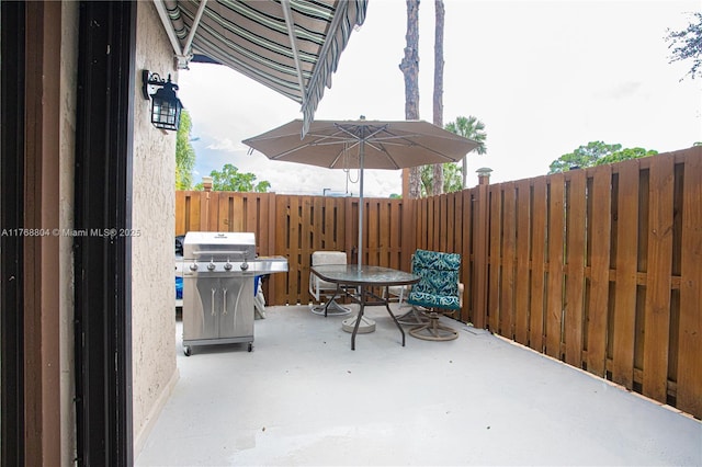4016 Palm Bay Cir Unit C, West Palm Beach, FL 33406 - view of patio with outdoor dining area and grilling area