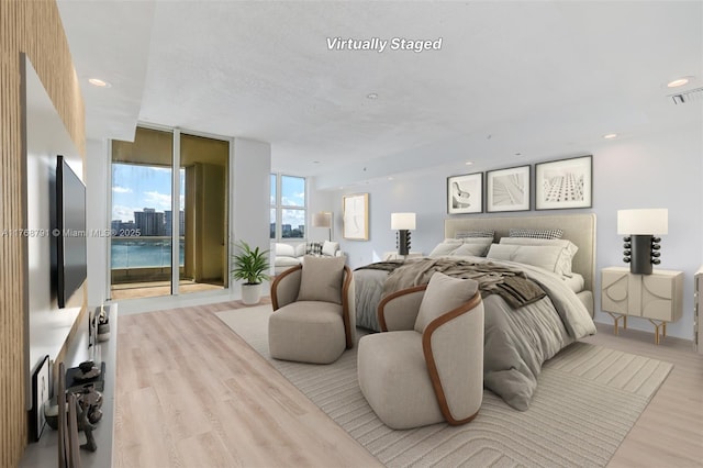 550 SE 5th Ave Unit 606S, Boca Raton, FL 33432 - bedroom featuring wood finished floors and recessed lighting