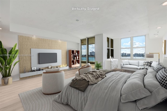550 SE 5th Ave Unit 606S, Boca Raton, FL 33432 - living room featuring wood finished floors, recessed lighting, and a textured ceiling