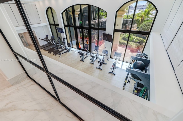 550 SE 5th Ave Unit 606S, Boca Raton, FL 33432 - exercise room featuring marble tiled floors and floor to ceiling windows