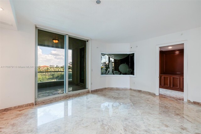 550 SE 5th Ave Unit 606S, Boca Raton, FL 33432 - unfurnished room featuring marble tiled flooring and baseboards