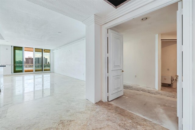 550 SE 5th Ave Unit 606S, Boca Raton, FL 33432 - spare room featuring a wall of windows and a textured ceiling