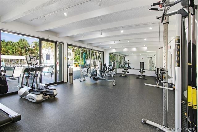 exercise room featuring a textured ceiling