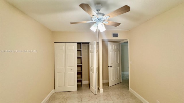 20381 NE 30th Ave Unit 118-7, Aventura, FL 33180 - unfurnished bedroom featuring a closet, baseboards, and a ceiling fan