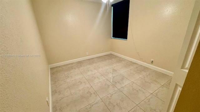 20381 NE 30th Ave Unit 118-7, Aventura, FL 33180 - empty room with baseboards and light tile patterned floors