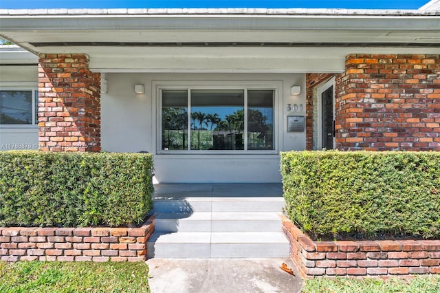 501 NE 51st St, Miami, FL 33137 - property entrance featuring stucco siding and covered porch