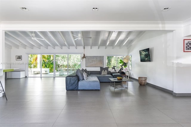 living room with a ceiling fan, lofted ceiling with beams, baseboards, and visible vents