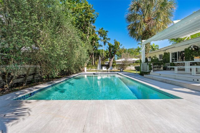 pool with a patio area