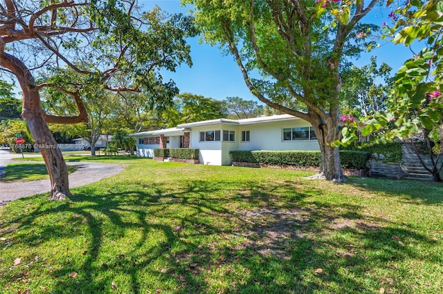 501 NE 51st St, Miami, FL 33137 - single story home featuring a front yard and stucco siding