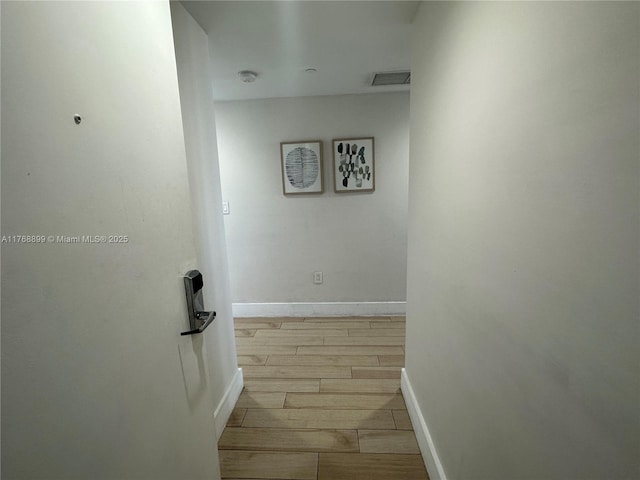 2600 E Hallandale Beach Blvd Unit T2202, Hallandale Beach, FL 33009 - hall featuring wood finish floors, visible vents, and baseboards