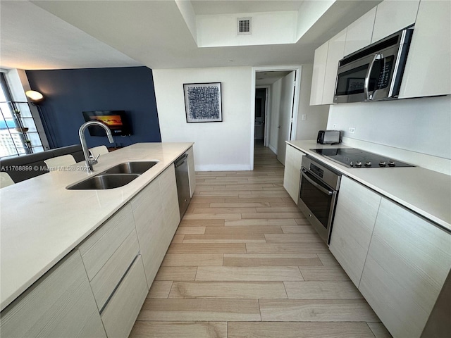 2600 E Hallandale Beach Blvd Unit T2202, Hallandale Beach, FL 33009 - living area with light wood-style floors, rail lighting, baseboards, and visible vents