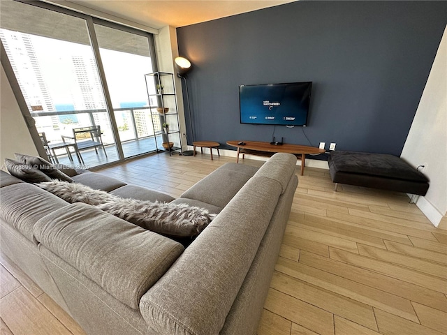 2600 E Hallandale Beach Blvd Unit T2202, Hallandale Beach, FL 33009 - living area featuring wood-type flooring, baseboards, and expansive windows