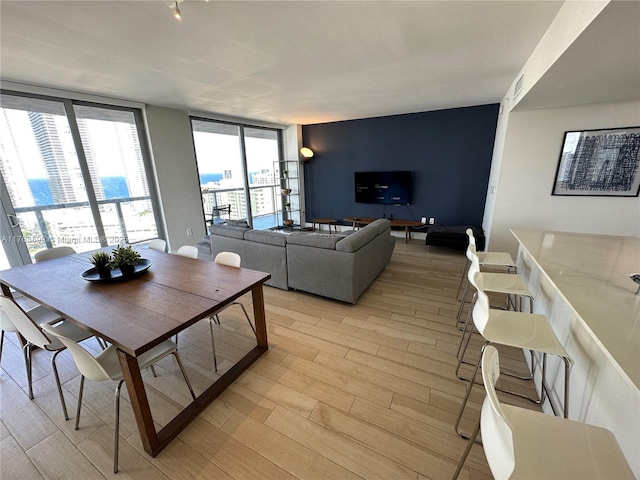 2600 E Hallandale Beach Blvd Unit T2202, Hallandale Beach, FL 33009 - living area with plenty of natural light, floor to ceiling windows, a city view, and light wood-type flooring
