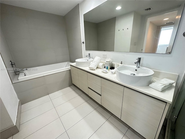 2600 E Hallandale Beach Blvd Unit T2202, Hallandale Beach, FL 33009 - bathroom featuring visible vents, a sink, a bath, and tile patterned floors
