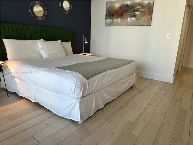 2600 E Hallandale Beach Blvd Unit T2202, Hallandale Beach, FL 33009 - bedroom with baseboards and wood finished floors