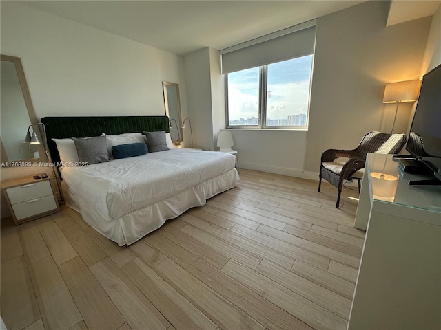2600 E Hallandale Beach Blvd Unit T2202, Hallandale Beach, FL 33009 - bedroom featuring baseboards and light wood finished floors