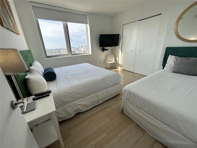 2600 E Hallandale Beach Blvd Unit T2202, Hallandale Beach, FL 33009 - bedroom with light wood finished floors and a closet