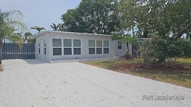 442 SW 22nd Ave, Fort Lauderdale, FL 33312 - view of front of property featuring fence and driveway