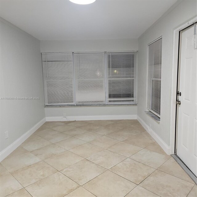 442 SW 22nd Ave, Fort Lauderdale, FL 33312 - empty room with light tile patterned floors and baseboards