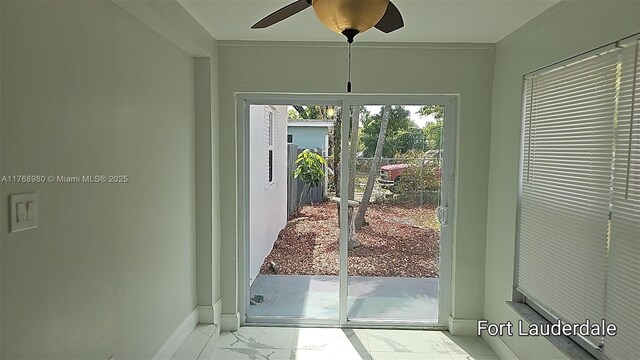 442 SW 22nd Ave, Fort Lauderdale, FL 33312 - doorway featuring marble finish flooring, baseboards, ceiling fan, and crown molding