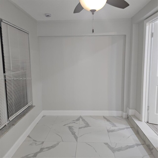 442 SW 22nd Ave, Fort Lauderdale, FL 33312 - spare room with a ceiling fan, light marble finish flooring, baseboards, and a smoke detector
