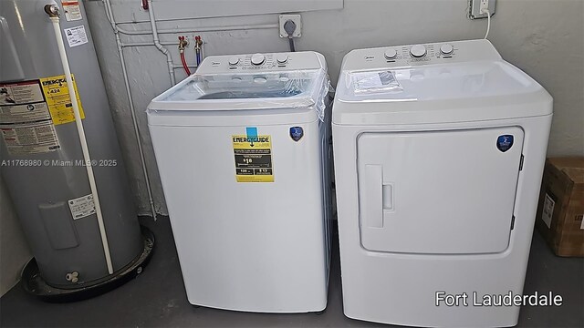 442 SW 22nd Ave, Fort Lauderdale, FL 33312 - laundry room featuring water heater and washer and dryer