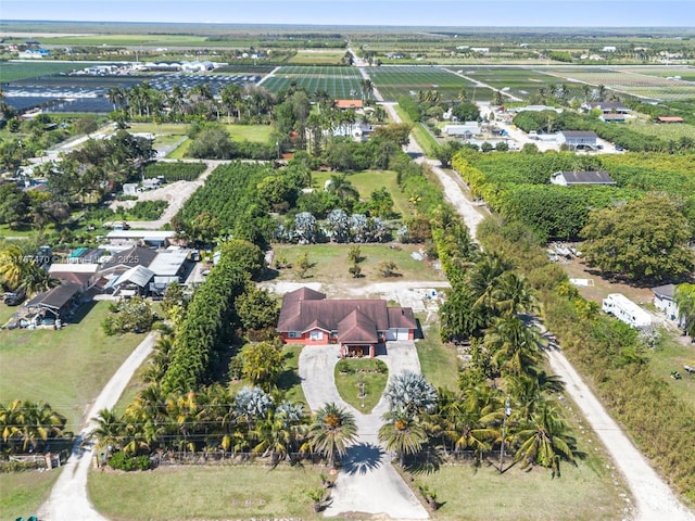 single story home with fence private yard, an attached garage, a front lawn, and curved driveway