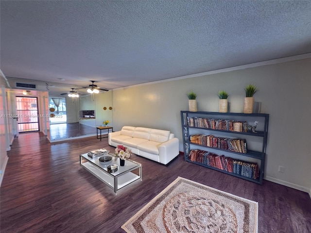 1103 NW 58th Ter Unit 224, Sunrise, FL 33313 - living area with a textured ceiling, wood finished floors, baseboards, a ceiling fan, and ornamental molding