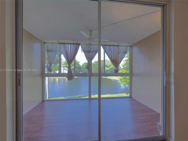 1103 NW 58th Ter Unit 224, Sunrise, FL 33313 - unfurnished sunroom featuring a water view