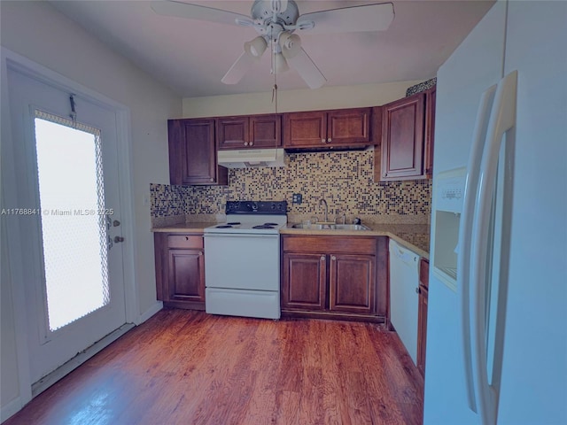 1103 NW 58th Ter Unit 224, Sunrise, FL 33313 - kitchen with white appliances, a sink, light countertops, under cabinet range hood, and light wood finished floors