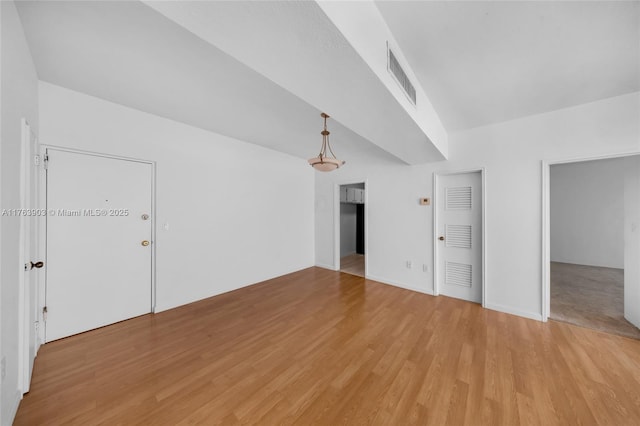 interior space featuring light wood-type flooring and visible vents