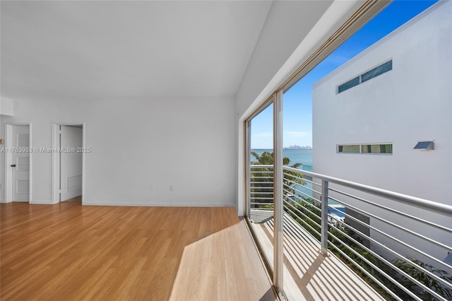 balcony with visible vents and a water view