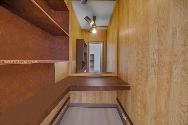 interior space with ceiling fan and wood finished floors