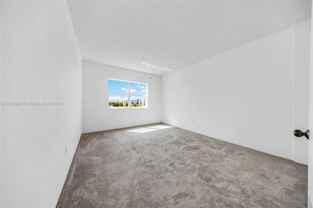 empty room with carpet flooring