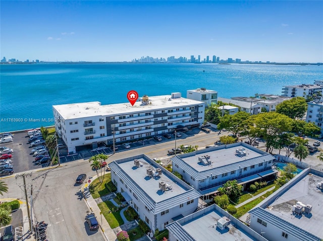 aerial view with a city view and a water view
