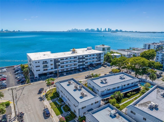 drone / aerial view with a water view and a view of city
