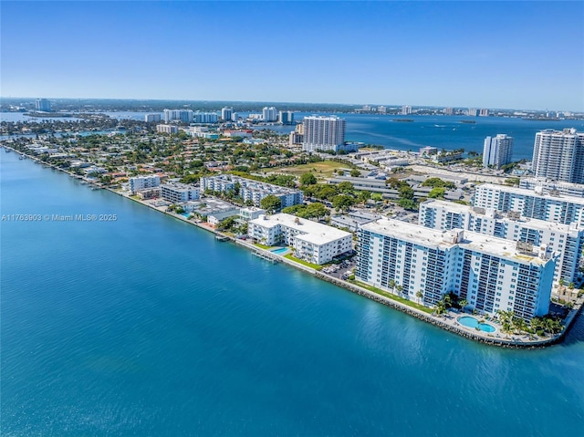 drone / aerial view featuring a water view and a view of city