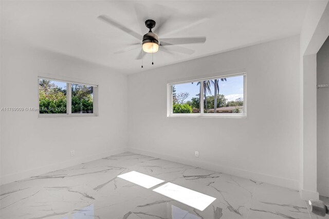 5241 Redwood Ct, Plantation, FL 33317 - unfurnished room featuring a ceiling fan, baseboards, and marble finish floor