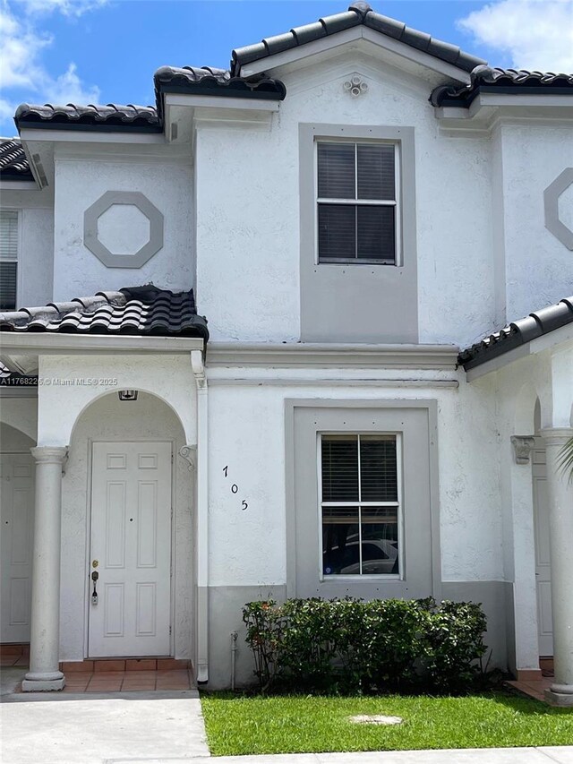 5450 NW 107th Ave Unit 705, Doral, FL 33178 - mediterranean / spanish-style home with a tile roof and stucco siding