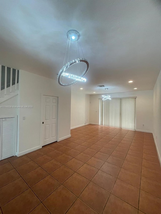 5450 NW 107th Ave Unit 705, Doral, FL 33178 - tiled spare room with a chandelier and recessed lighting