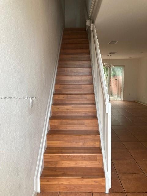 5450 NW 107th Ave Unit 705, Doral, FL 33178 - stairway with tile patterned flooring