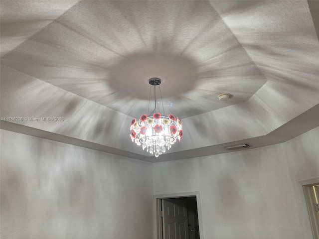 5450 NW 107th Ave Unit 705, Doral, FL 33178 - interior details featuring a notable chandelier and visible vents